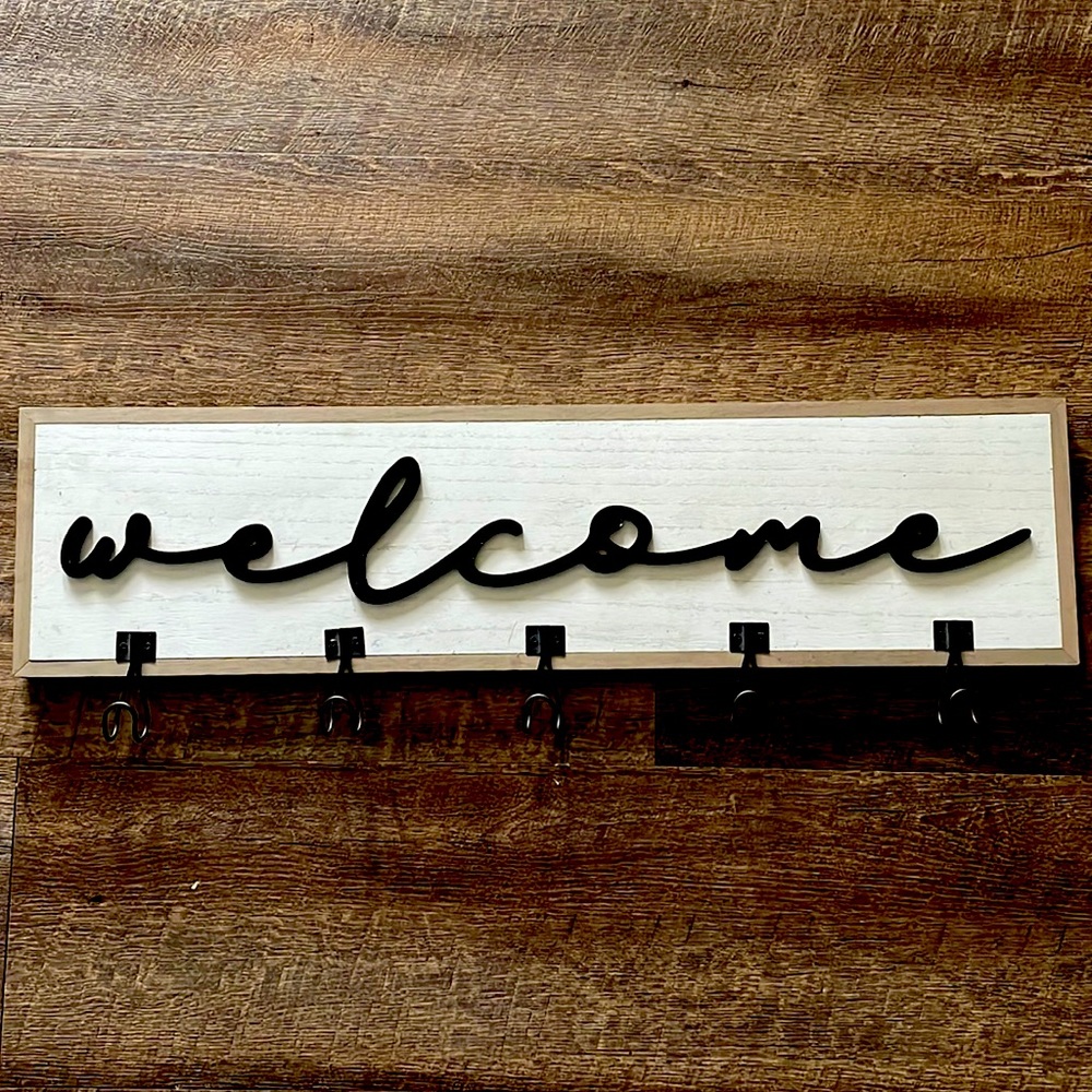 Welcome sign with hooks